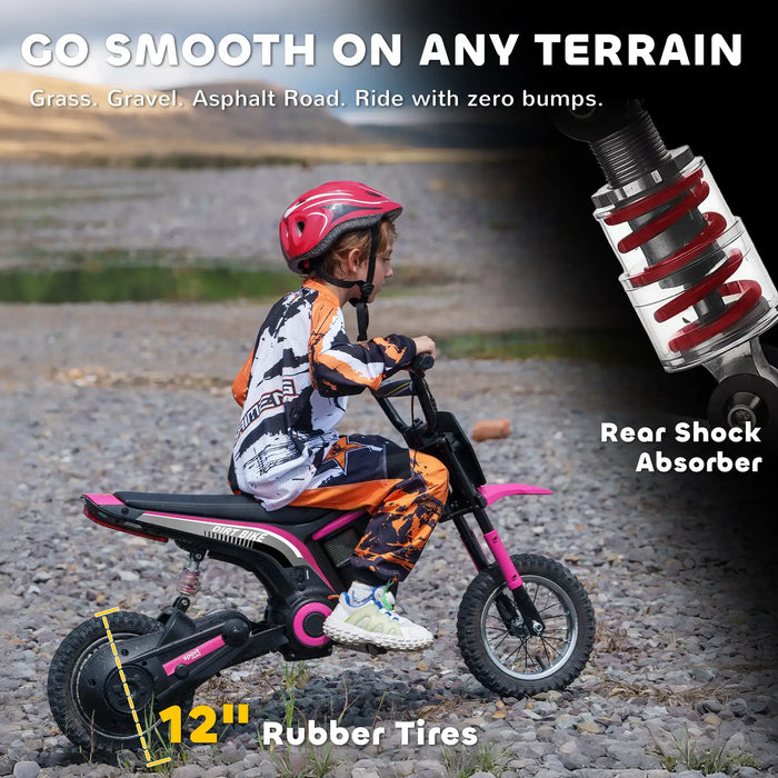 Child in motocross gear riding a pink 24V kids electric dirt bike with 12-inch rubber tires on gravel.