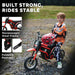Child in motocross outfit sits on red 24V kids electric dirt bike outdoors, steel frame, foldable footrests.