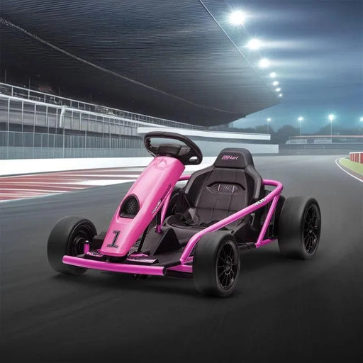 Pink 24V kids electric drift go kart on a race track at night