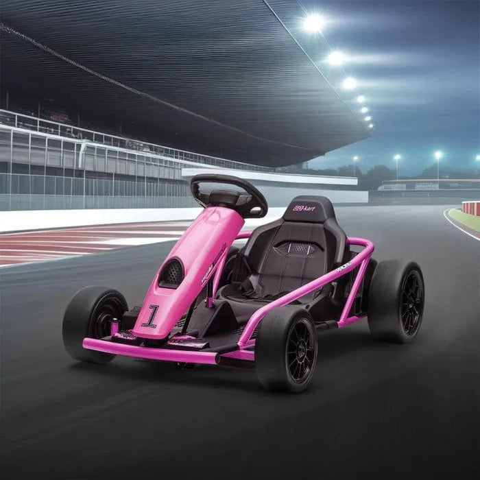 Pink 24V kids electric drift go kart on a race track at night