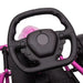 Close-up of black steering wheel on pink kids electric drift go-kart