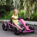 Girl riding pink 24V kids electric drift go kart outdoors on garden path