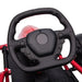 Close-up of black steering wheel on red kids electric drift go kart