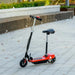 Red 24V kids ride on powered scooter with seat, handbrake, and bell on paved outdoor path