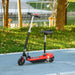 Red 24V kids ride-on electric scooter with seat, handbrake, and bell on a park path