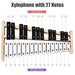 Xylophone with 27 notes showing white whole tone keys and black semitone keys on wooden frame