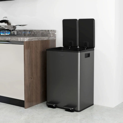 Black trash bin with a foot pedal in a kitchen setting