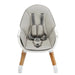 Baby high chair with gray cushion and wooden legs on a white background