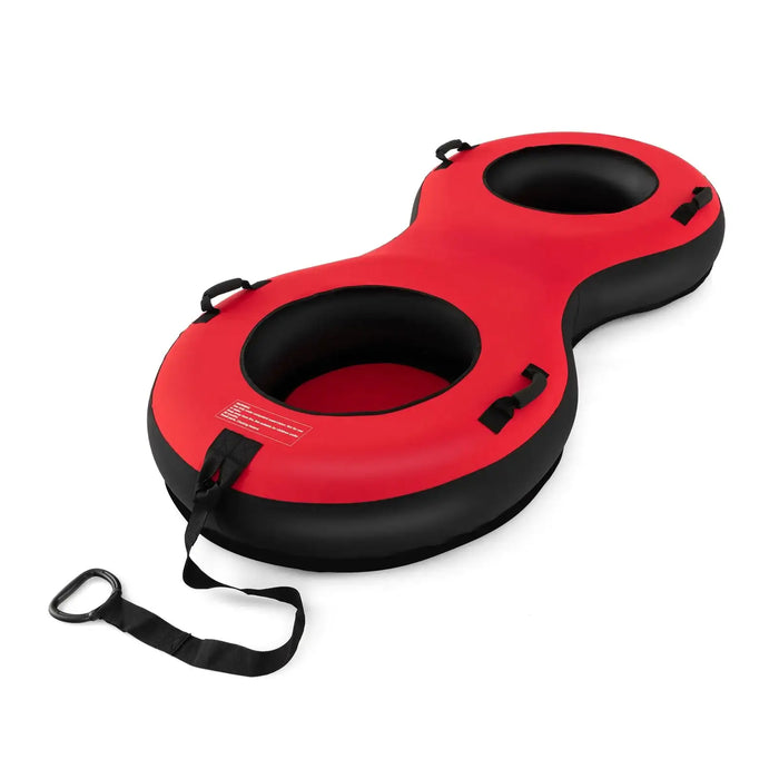 Red and black inflatable two-person snow tube with handles and a tow strap on white background