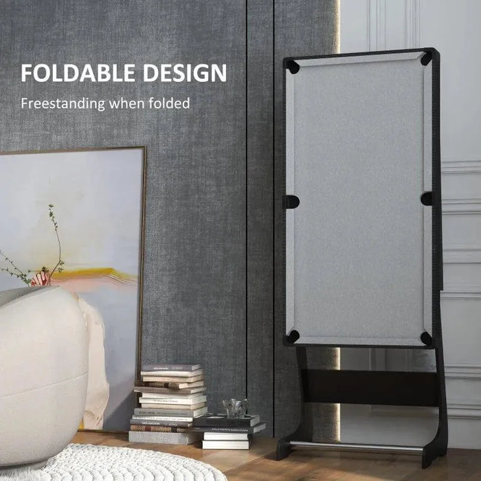 Foldable compact pool table freestanding in modern living room, books and art in background