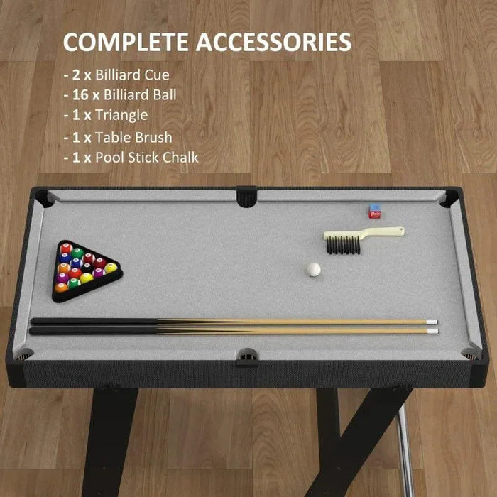 Compact 3.5ft pool table with accessories including cues, balls, triangle, brush, and chalk on wooden floor