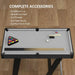 Compact 3.5ft pool table with accessories including cues, balls, triangle, brush, and chalk on wooden floor