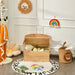 Children's room with wooden toy chest, colorful toys, and decorative items.
