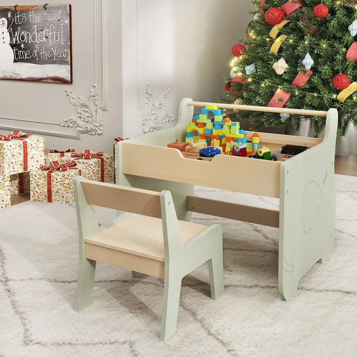 Children's play table with chair and toys in a room decorated for Christmas.