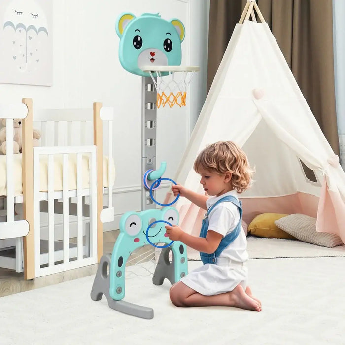 Child playing with a toy in a nursery room with a crib, tepee, and baby monitor.