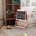Pink 3-in-1 kids easel with blackboard, animal storage bins, and toys in a cozy playroom