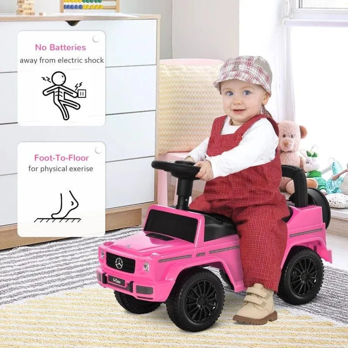 Toddler riding pink Mercedes-Benz G350 sliding car toy indoors, playful and safe foot-to-floor design.