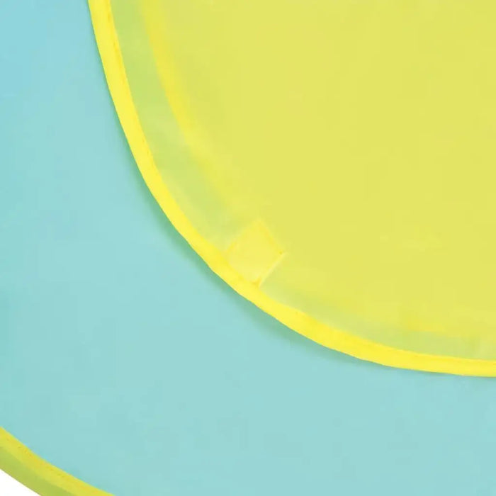Close-up of yellow fabric edge on blue surface, kids play tent material detail.