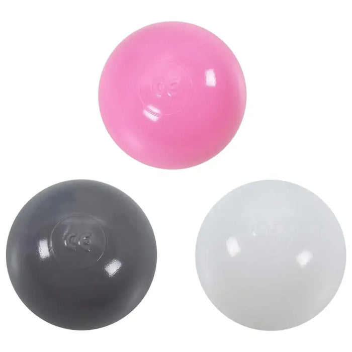Pink, gray, and white plastic play balls for kids' princess castle play tent.