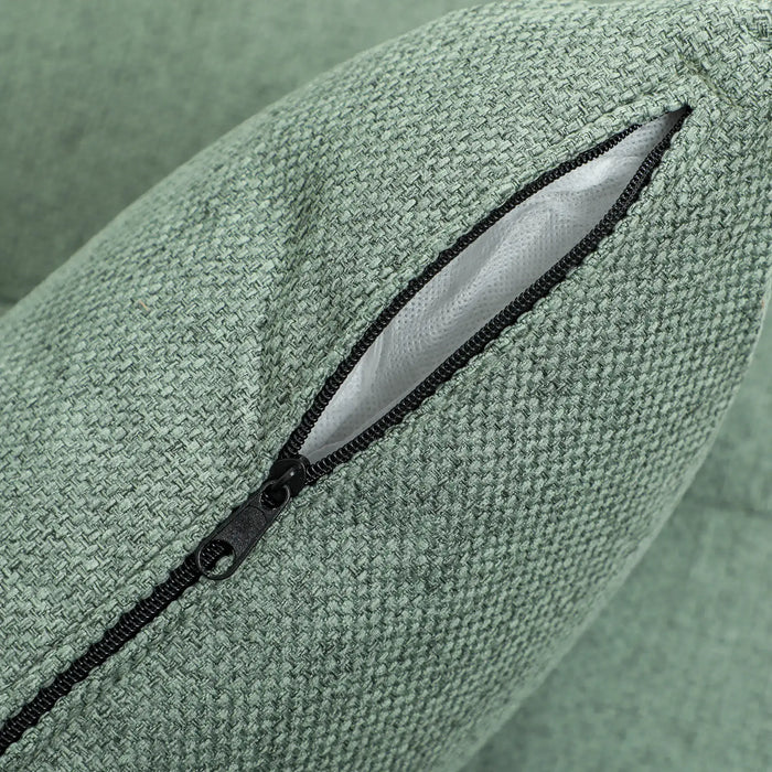 Close-up of a green textured fabric with a zipper pocket.