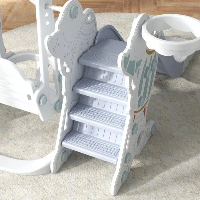 3-in-1 space-themed kids swing and slide set with basketball hoop on carpeted floor