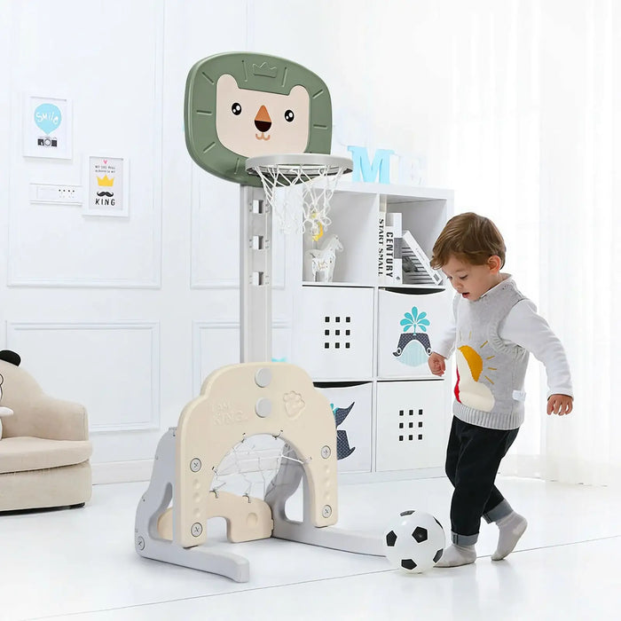 Child playing with a toy basketball hoop and soccer ball in a room with white walls and furniture.