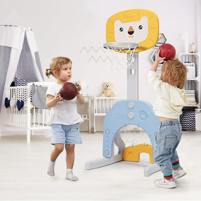 Two children playing with a colorful basketball hoop and balls in a room.