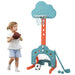 Toddler holding basketball near colorful kids basketball hoop with soccer goal and golf accessories