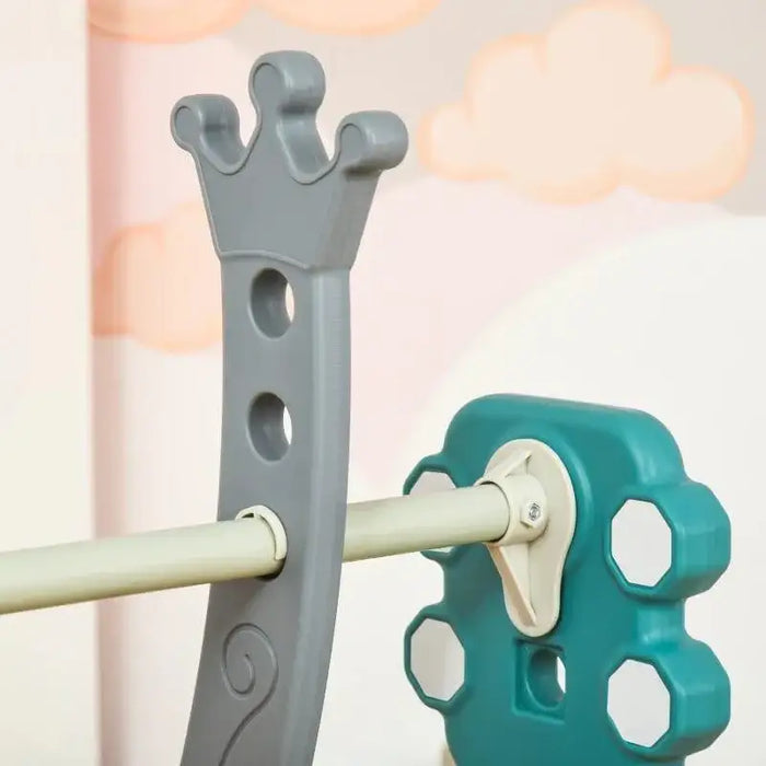 Close-up of toddler swing and slide set with crown-shaped gray support and teal connector