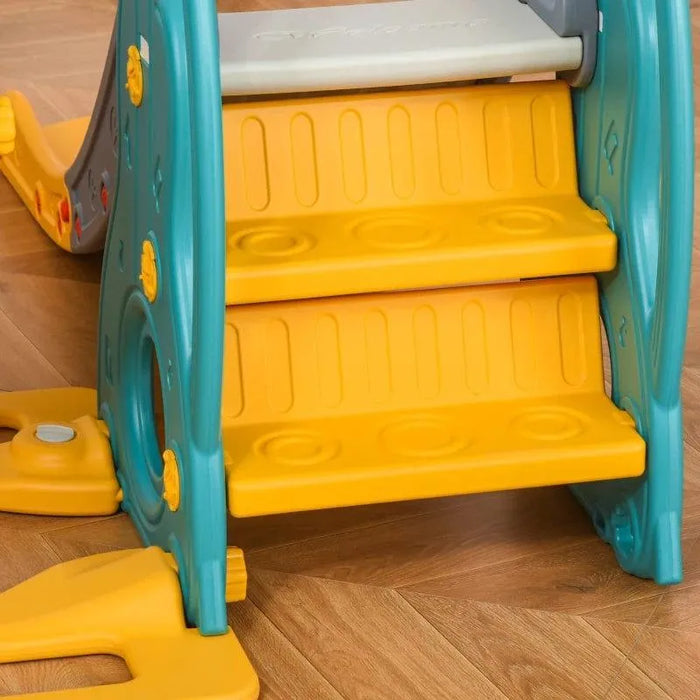 Close-up of yellow toddler slide steps with teal sides on wooden floor