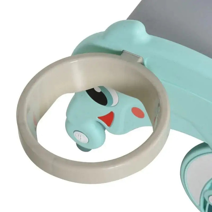 Close-up of kids' frog-themed basketball hoop and slide in light blue and beige plastic.