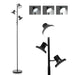 Black floor lamp with adjustable reading lights on a white background