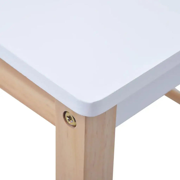 Close-up of kids table with white tabletop and light wooden legs