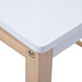 Close-up of kids table with white tabletop and light wooden legs