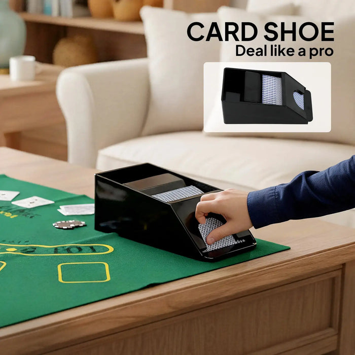 Black card shoe on green poker table with hand dealing cards in cozy living room setting