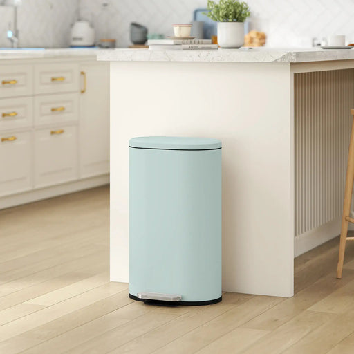 Light blue trash can in a kitchen setting