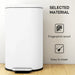 White trash bin with fingerprint-proof and easy-to-clean features on a light wood floor.