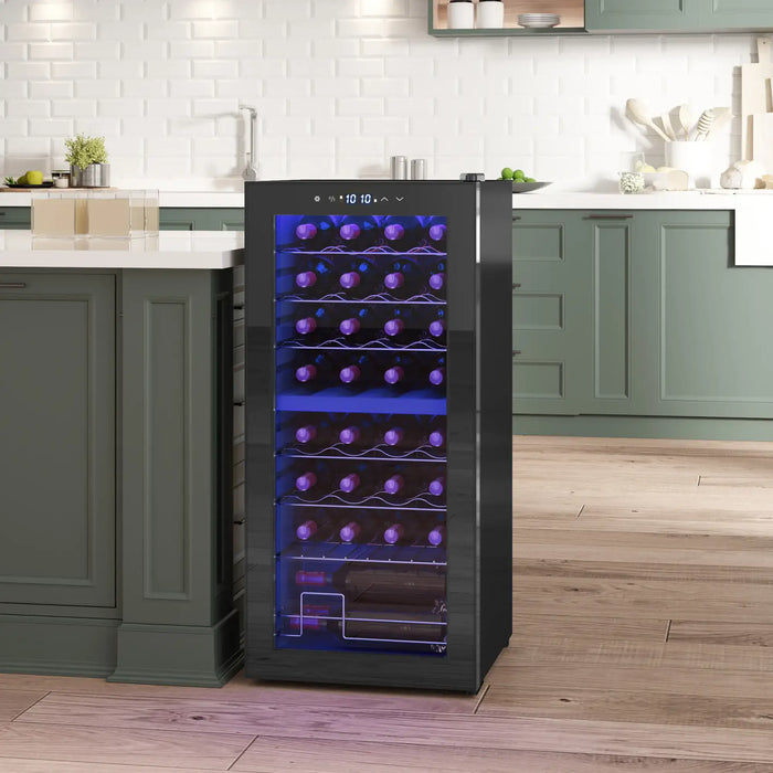 Wine cooler in a kitchen setting with green cabinets and white countertops.