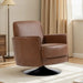 Brown leather armchair in a room with a lamp and curtains.