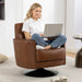 Woman using a laptop in a brown leather armchair in a modern living room.