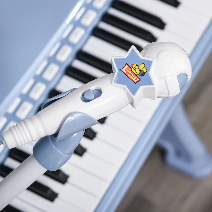 Blue kids 37-key piano with white toy microphone and star-shaped button