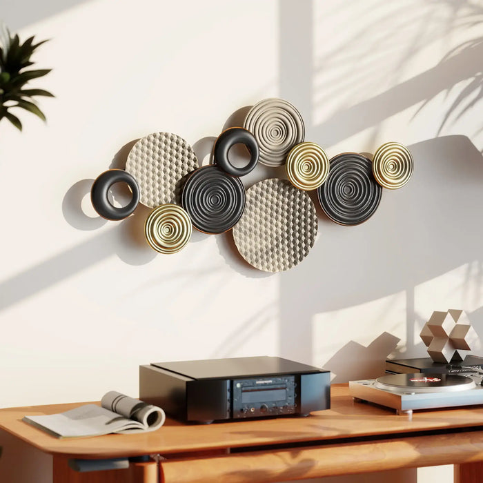 Decorative wall art with circular designs in a modern interior setting.