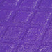 Close-up of a textured purple plastic surface with diamond pattern.