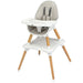 Baby high chair with beige cushion and wooden legs on a white background