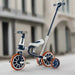 Navy 4-in-1 training balance trike with adjustable seat and push handle outdoors