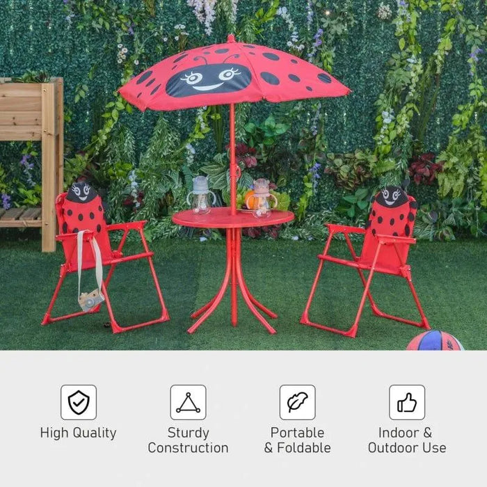 Kids red and black ladybird dining set with two chairs, round table, and adjustable parasol on grass