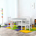 Grey and white kids table chair set with storage bench on colorful play mat in playroom