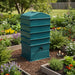 4-tray HDPE worm composter for organic waste in a flower-filled garden