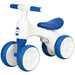 White and blue 4-wheel kids balance bike with enclosed wheels and cushioned seat