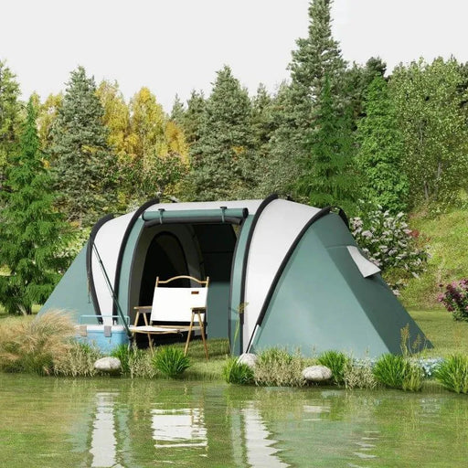 Dark green tunnel tent with chair and cooler by a pond in a forest campsite setting